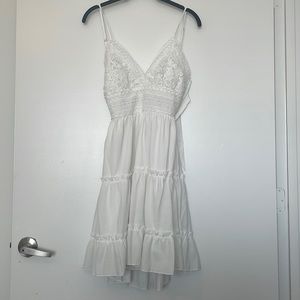 White babydoll style dress. Size small. Ties in back.
